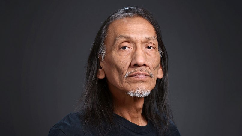 Native American advocate Nathan Phillips, of Ypsilanti, Mich., sits for a portrait in Ypsilanti on May 2, 2015. Phillips gained national attention after a standoff between him and a group of Catholic high school students went viral on Jan. 18, 2019, in Washington, D.C. Photo by Chris Stranad