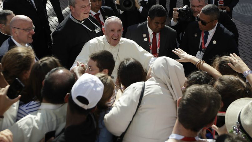 Pope Francis greets pilgrims as he arrives to celebrate Mass at the Santa Maria La Antigua cathedral on the occasion of his visit for World Youth Day, in Panama City, Saturday, Jan. 26, 2019. Francis turns his attention to the country's priests and religious sisters as he reaches the midway point in his five-day Central American visit. (AP Photo/Alessandra Tarantino)