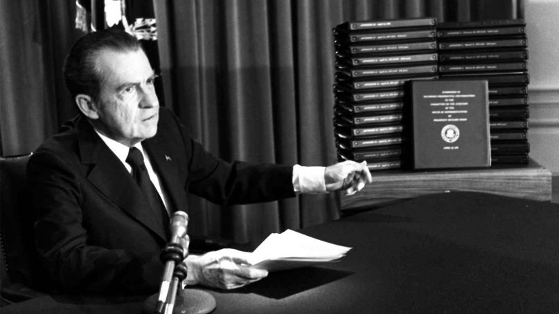 President Nixon gestures toward transcripts of White House tapes after announcing he would turn them over to House impeachment investigators and make them public in April of 1974. (AP Photo)