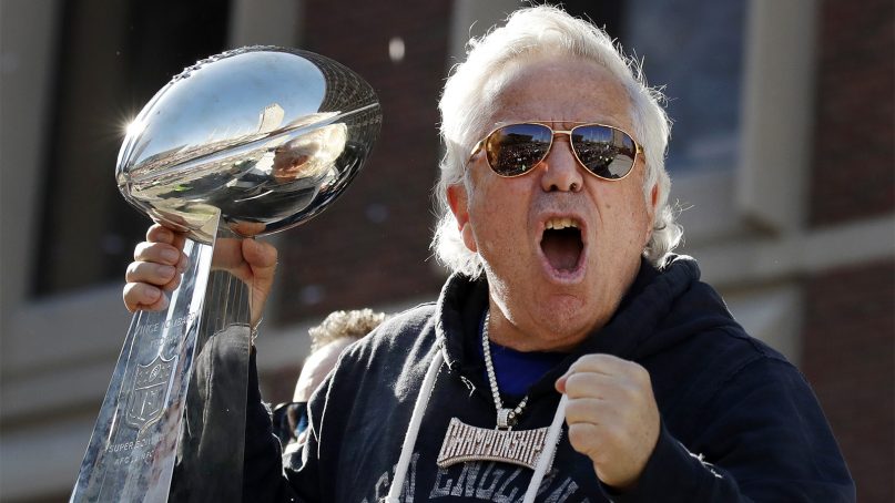 New England Patriots owner Robert Kraft yells to fans during the team's victory parade through downtown Boston on Feb. 5, 2019, to celebrate its Super Bowl win over the Los Angeles Rams in Atlanta. (AP Photo/Elise Amendola)
