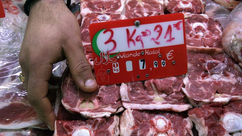 A butcher arranges halal meats at a butcher shop in Paris, France, in March 2012. (AP Photo/Michel Euler)