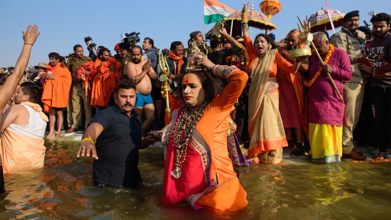 Laxmi Narayan Tripathi takes a dip at Triveni Sangam in Prayagraj, formerly called Allahabad, on Feb. 10, 2019, during the Kumbh Mela festival in India. RNS photo by Shantanu Saha
