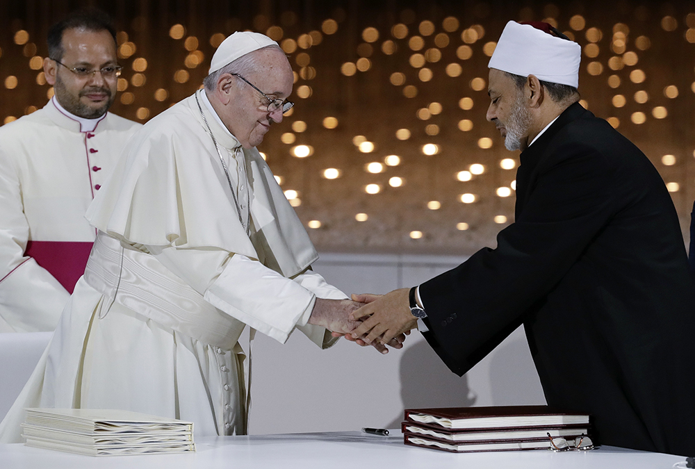 Pope Francis greets Sheikh Ahmed el-Tayeb, the grand imam of Egypt's Al-Azhar, after an interreligious meeting at the Founder's Memorial in Abu Dhabi, United Arab Emirates, on Feb. 4, 2019. Pope Francis has asserted in the first-ever papal visit to the Arabian Peninsula that religious leaders have a duty to reject all war and commit themselves to dialogue. (AP Photo/Andrew Medichini)