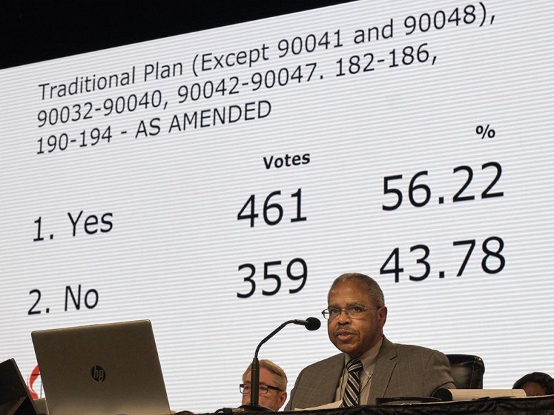 As the Rev. Joe Harris presides, the results of a vote about the so-called Traditional Plan are displayed during a legislative session of the special session of the General Conference of the United Methodist Church, held in St. Louis on Feb. 25, 2019. The plan would strengthen denominational penalties for LGBTQI clergy and for clergy who perform same-sex weddings. Photo by Paul Jeffrey for United Methodist News Service