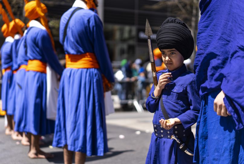 Bir Singh, 7, of Hicksville, N.Y., stands with other marchers near the front of the Sikh Day Parade, an annual Nagar Keertan 