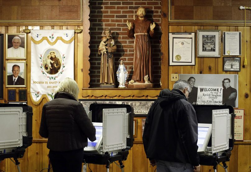 Voters cast their ballots at a polling place inside St. Leo's Catholic Church in Baltimore on Election Day, Nov. 6, 2012. (AP Photo/Patrick Semansky)