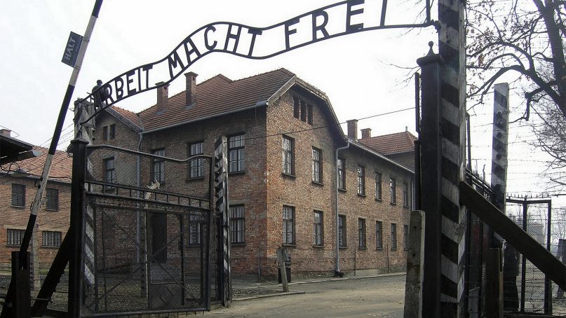 The main gate of Auschwitz I camp in Poland, which was operated by German Nazis during World War II. Photo by Roland Fischer/Creative Commons
