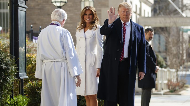President Trump, with first lady Melania Trump and the Rev. Bruce McPherson, waves as he arrives to attend service at St. John's Church in Washington on March 17, 2019. (AP Photo/Carolyn Kaster)