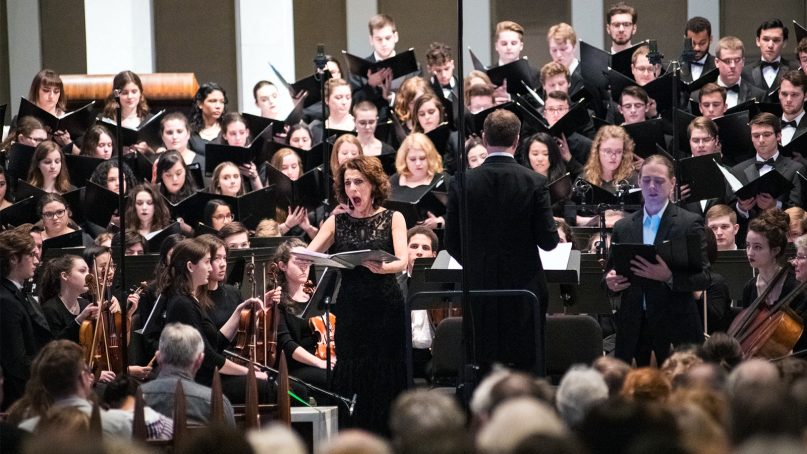 The American University orchestra performs “A Choral Symphony: Halevi,” by Arnold Saltzman, with soloist Janice Meyerson, center, singing at the National Presbyterian Church on Feb. 24, 2019, in Washington. Photo by Jeff Watts/American University