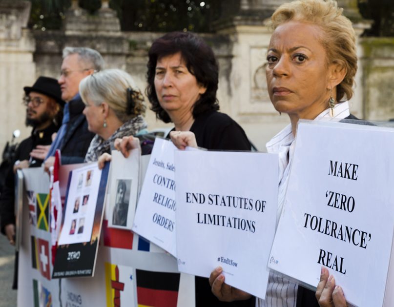 Denise Buchanan, right, a psychoneurologist and founding member of the Ending Clergy Abuse  organization, and member Leona Huggins, second from right, participate in a protest outside the St. Anselm on the Aventine Benedictine complex in Rome on the second day of a summit called by Pope Francis at the Vatican on sex abuse in the Catholic Church on Feb. 22, 2019. (AP Photo/Domenico Stinellis)