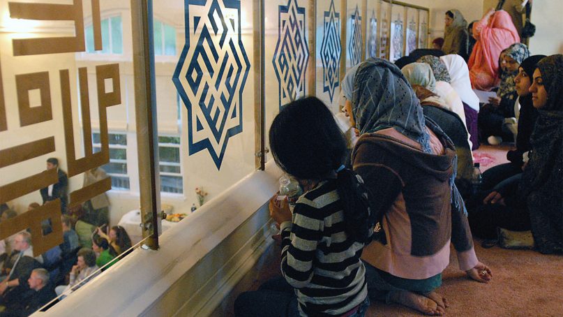 Women and girls as they watch from the loft of the Islamic Center of South Jersey as speakers address men attending a town hall meeting at the mosque on May, 18, 2007, in Palmyra, N.J. (AP Photo)