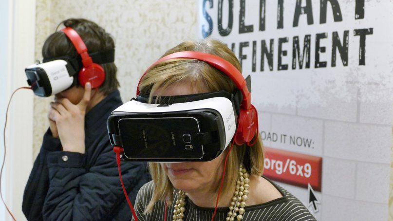 People experience a sample of life in solitary confinement with the help of virtual reality glasses and headphones presented by the National Religious Campaign Against Torture during the Ecumenical Advocacy Days on April 22, 2018, in Washington. Photo courtesy of NRCAT