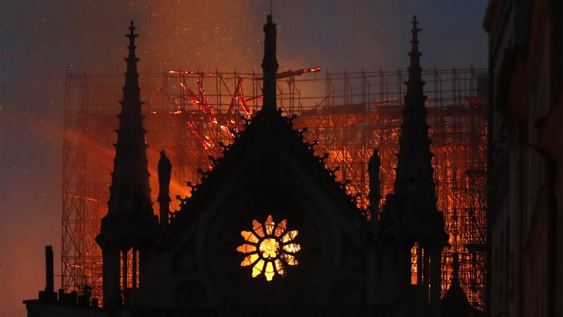 Flames and smoke rise from Notre Dame Cathedral as it burns in Paris on April 15, 2019. (AP Photo/Thibault Camus)