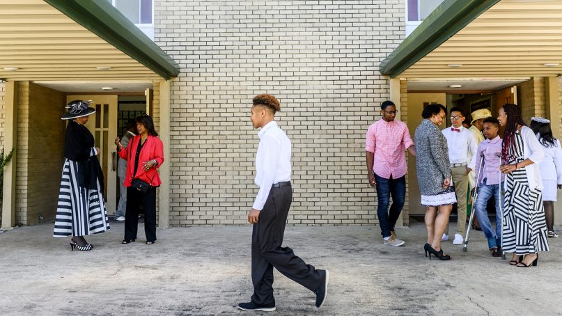 Parishioners visit after an Easter Sunday service at Little Zion Church in Opelousas, La., on April 21, 2019. The area has been reeling after several local churches were destroyed by Arson earlier in the month. RNS photo by Emily Kask