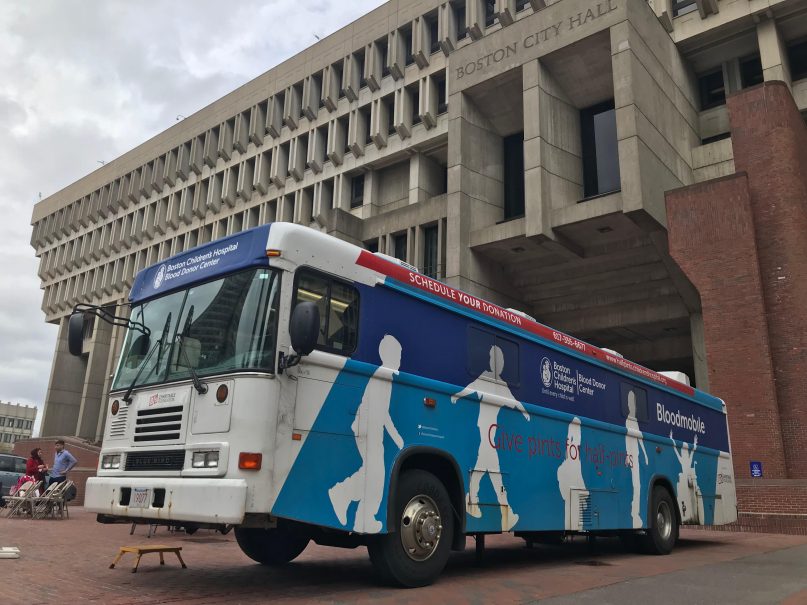 Muslims from Baitun Nasir Mosque in Sharon, host a blood drive within Massachusetts Boston Children’s Hospital Blood Donor Center Bloodmobile, parked outside the Boston City Hall on April 19, 2019. Photo by Aysha Khan.