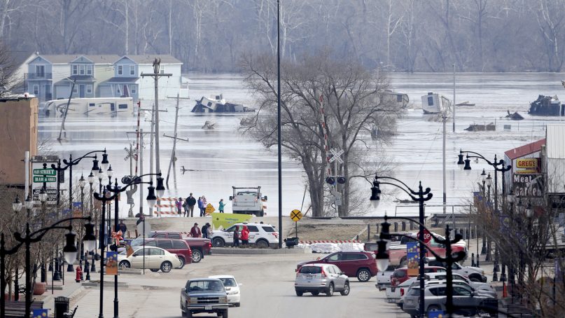People view the rising waters from the Platte and Missouri rivers, which flooded areas of Plattsmouth, Neb., on March 17, 2019. (AP Photo/Nati Harnik)