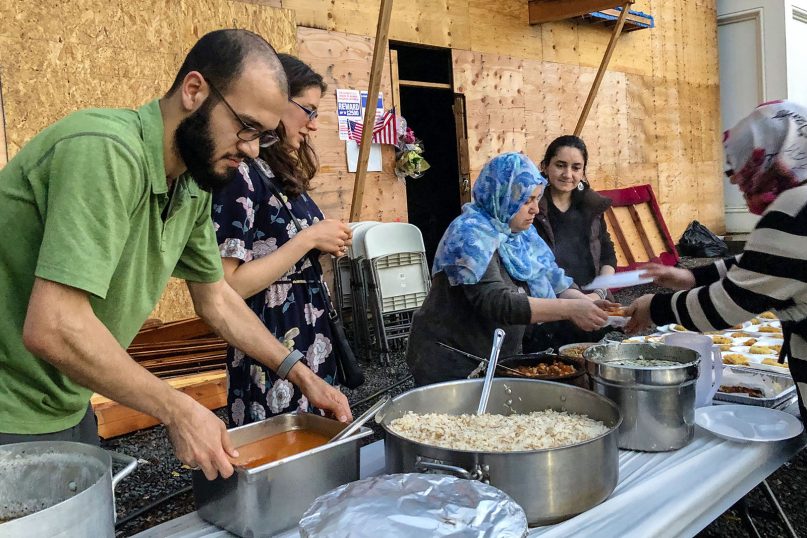 Volunteers prepare the iftar meal outside the Diyanet Mosque of New Haven, Conn., on May 20, 2019. 

RNS photo by Rhonda Roumani
