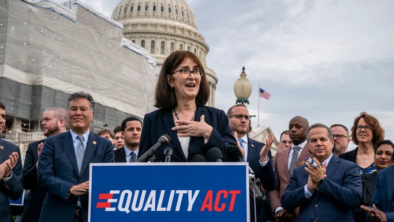 Transgender rights activist Mara Keisling joins advocates for LGBTQ rights as they rally before a vote in the House on the 
