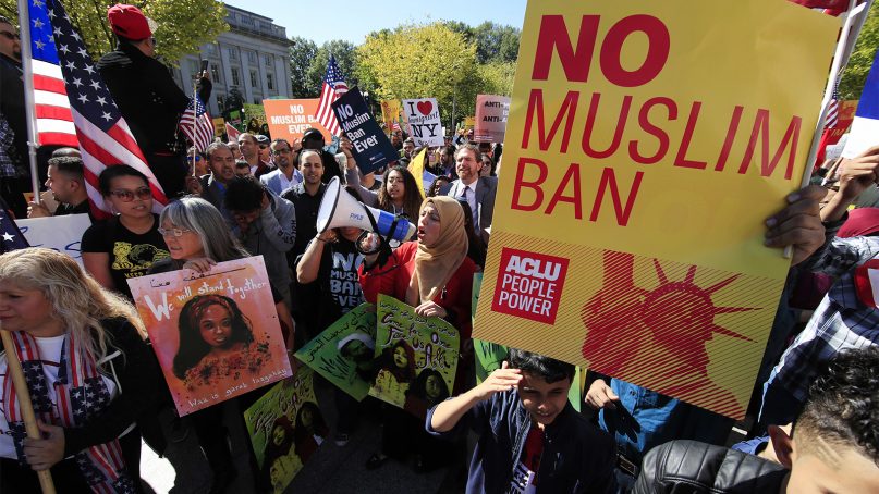 Muslim and civil rights groups and their supporters gather at a rally against what they call a 