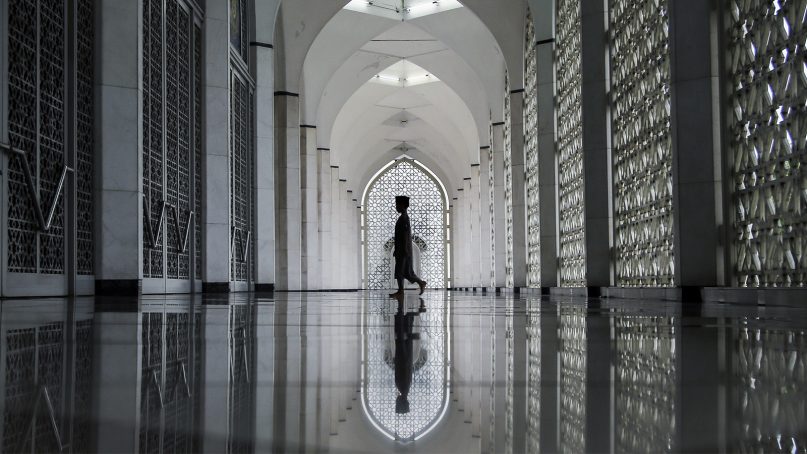 A Muslim boy arrives at a mosque during Ramadan in Shah Alam, Malaysia, on May 30, 2019. (AP Photo/Annice Lyn)