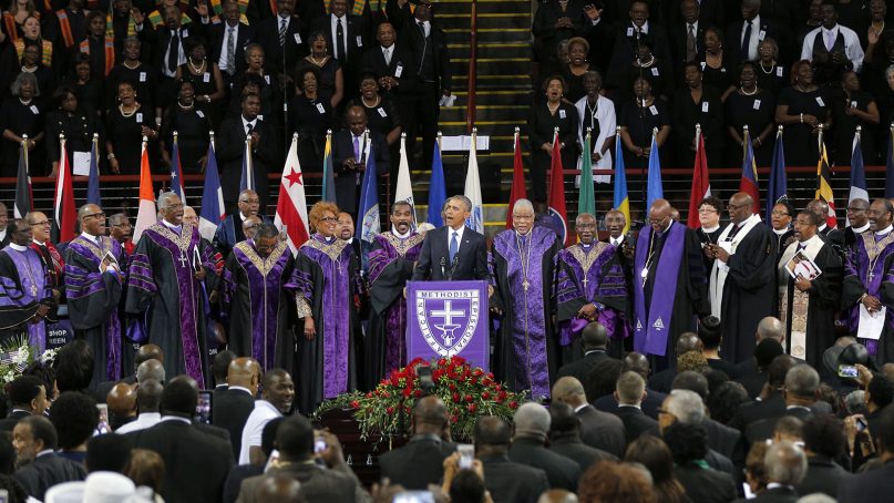 President Barack Obama leads mourners in singing 