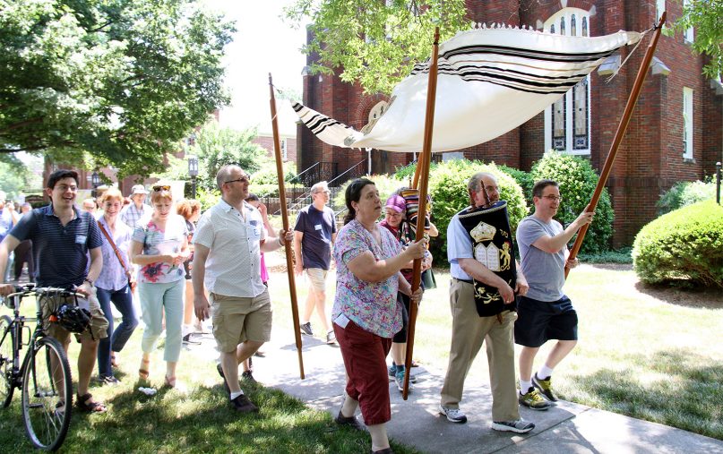 People participate in the Torah March, leaving Trinity Avenue Presbyterian Church grounds en route to Beth El Synagogue, on May 19, 2019, in Durham, N.C. Photo courtesy of Beth El Synagogue