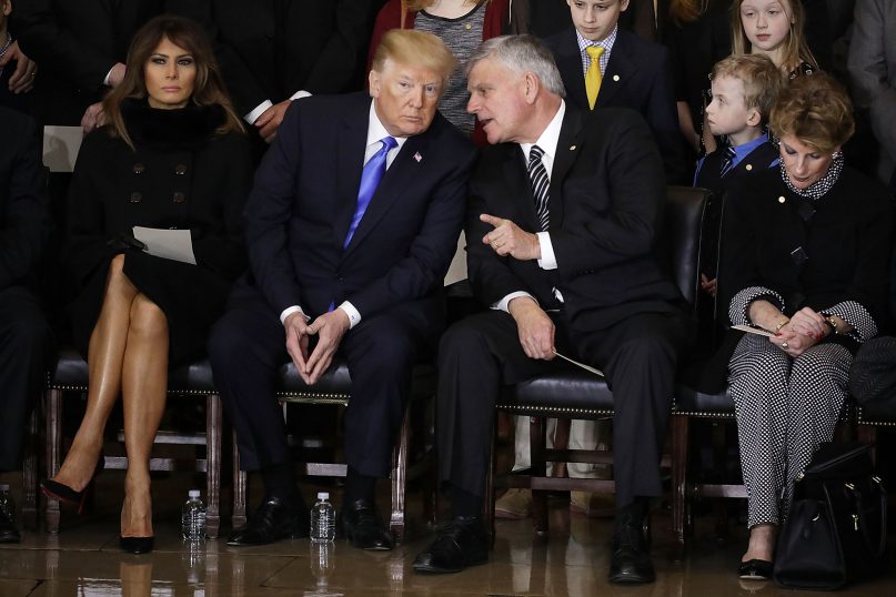 President Donald Trump speaks to the Rev. Franklin Graham as they attend a ceremony to honor the late Rev. Billy Graham in the U.S. Capitol Rotunda, on Feb. 28, 2018, in Washington. (Chip Somodevilla/Pool via AP)