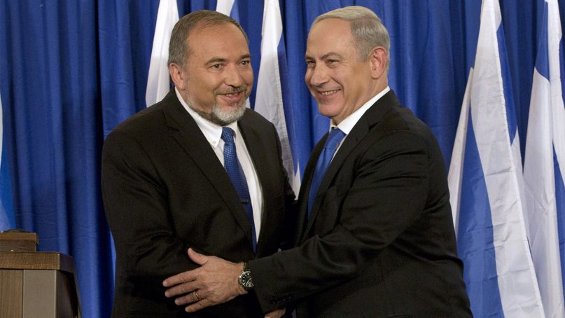 Israeli Prime Minister Benjamin Netanyahu, right, and former Israeli Defense Minister Avigdor Lieberman in 2012. (AP Photo/Bernat Armangue)
