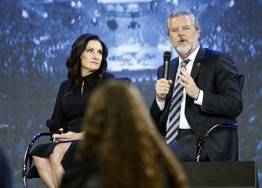 Jerry Falwell Jr., right, answers a student’s question, along with his wife, Becki, during a town hall on the opioid crisis at a convocation at Liberty University in Lynchburg, Virginia, on Nov. 28, 2018. (AP Photo/Steve Helber)