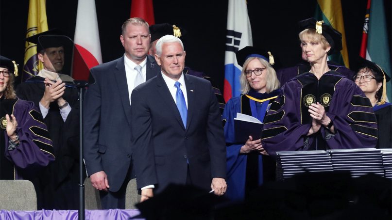 Vice President Mike Pence attends the Taylor University commencement on May 18, 2019, in Upland, Ind. Dozens of graduates and faculty protested the selection of Pence as the commencement speaker at Taylor University in Indiana by walking out moments before his introduction. (Michelle Pemberton/The Indianapolis Star via AP)