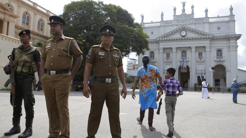 In this Sunday, May 12, 2019, photo, Sri Lankan soldiers stand guard at the entrance to Good Shepherd convent and the St. Benedict's college in Colombo, Sri Lanka. Catholic officials and parents in Sri Lanka are hopeful that church-run schools will begin to reopen soon for the first time since April’s devastating Easter Sunday attacks on churches and hotels. (AP Photo/Eranga Jayawardena)