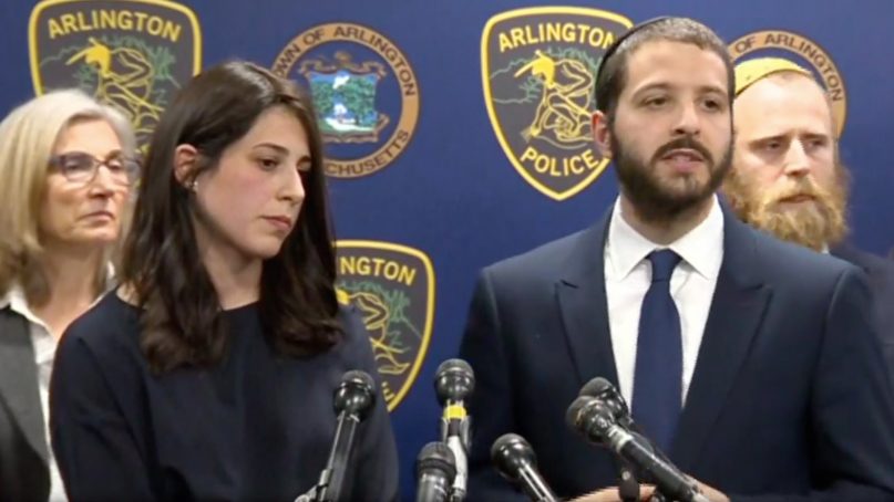 Rabbi Avi Bukiet, right, with his wife, Luna, addresses a news conference after multiple recent arson attempts on the Chabad Center for Jewish Life in Arlington, Mass. Video screenshot