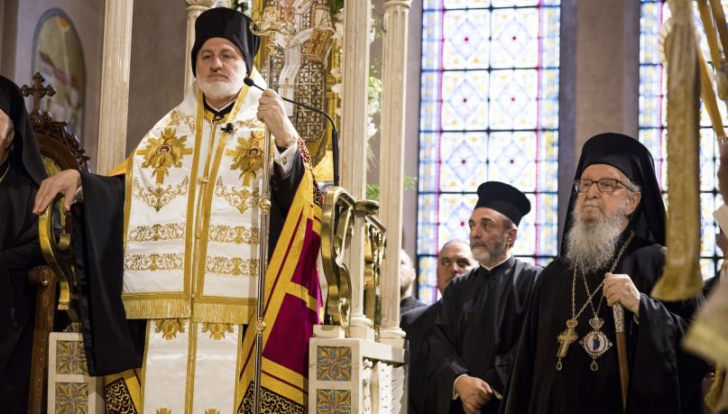 Archbishop Elpidophoros, left, stands at his throne on the altar next to his predecessor, former Archbishop Demetrios, right, inside the Archdiocesan Cathedral of the Holy Trinity during Elpidophoros’ enthronement ceremony as the new archbishop for America, Saturday, June 22, 2019, in New York. Elpidophoros is the seventh archbishop for America for the Greek Orthodox Church. (AP Photo/Julius Motal)