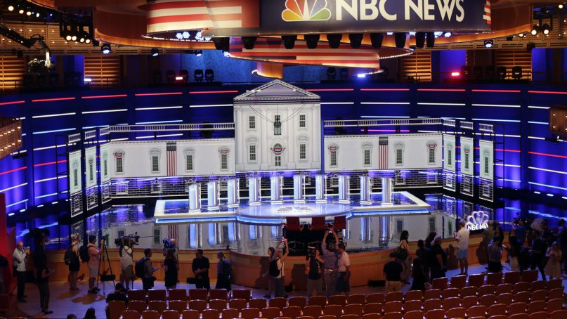 Members of the media gather for a walk-through of the stage set-up for the first Democratic debate on June 26, 2019. Ten presidential candidates, led by Sen. Elizabeth Warren, are set to converge on the debate stage on the first night of Democratic debates to offer their pitches to the American people and attempt a breakout moment for their campaigns. (AP Photo/Marta Lavandier)