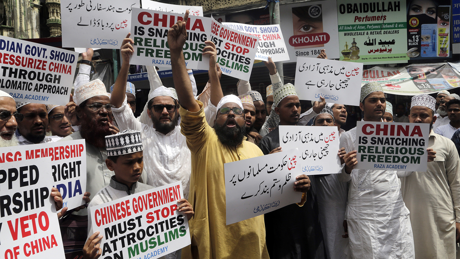Indian Muslims shout slogans during a protest against the Chinese government, in Mumbai, India, on Sept. 14, 2018. Nearly 150 Indian Muslims held a street protest in Mumbai, demanding that China stop detaining thousands of members of the minority Uighur Muslim ethnic group in detention and political indoctrination centers in the Xinjiang region. (AP Photo/Rajanish Kakade)
