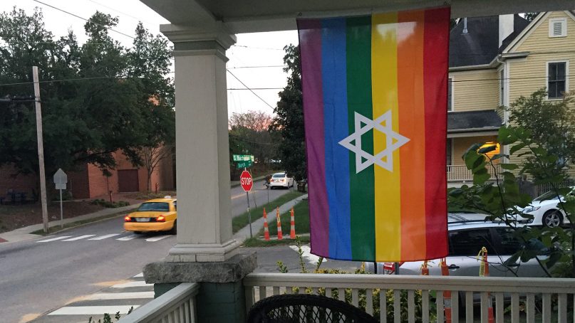 A Jewish pride flag featuring a Star of David hangs from a porch in Durham, N.C. RNS photo by Yonat Shimron