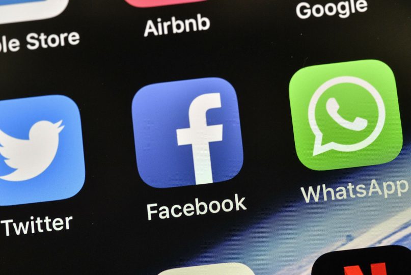 In this Nov. 15, 2018, file photo, the icons of Facebook and WhatsApp are pictured on an iPhone. (AP Photo/Martin Meissner)