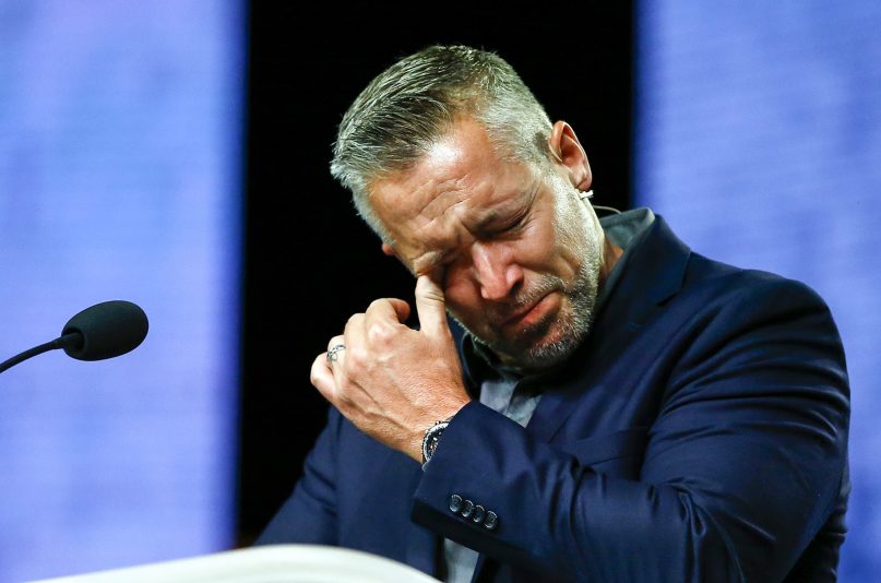 Southern Baptist Convention President J.D. Greear cries during a lamenting prayer for the sexual abuse that has occurred in the church. The prayer took place June 12, 2019, during the annual meeting of the Southern Baptist Convention at the Birmingham-Jefferson Convention Complex in Birmingham, Ala. RNS photo by Butch Dill