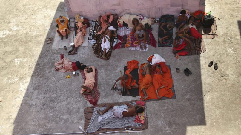 Hindu holy men rest at the Amarnath Yatra base camp in Jammu, India, on July 1, 2019. (AP Photo/Channi Anand)