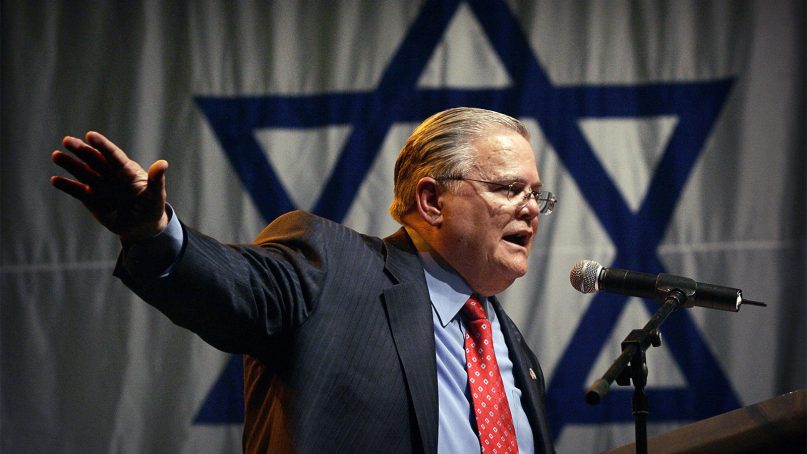 Influential Texas evangelist John Hagee, of Christians United for Israel, addresses a crowd of his followers and Israeli supporters at a rally at the Jerusalem convention center on April 6, 2008. (AP Photo/Sebastian Scheiner)