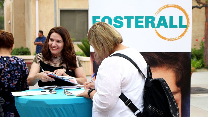 Noemi Amezcua, left, works to recruit potential foster families for FosterAll outside St. Elizabeth Ann Seton Church, a parish within the Archdiocese of Los Angeles, on Father’s Day, June 16, 2019. RNS photo by Heather Adams