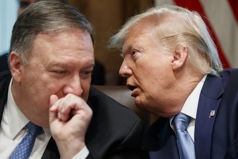 Secretary of State Mike Pompeo, left, and President Trump whisper during a Cabinet meeting in the Cabinet Room of the White House on July 16, 2019, in Washington. (AP Photo/Alex Brandon)