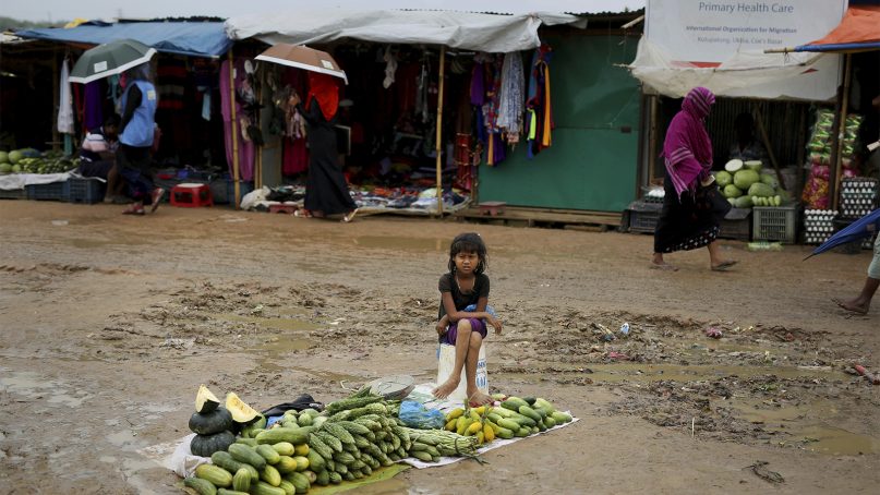 A Rohingya refugee girl sells vegetables in Kutupalong refugee camp, Bangladesh, on Aug. 28, 2018.  More than half a million Rohingya children live in the congested camps. They rely on 1,200 learning centers set up by aid organizations that can’t accommodate everyone and only offer classes up to a 5th-grade level. Most Rohingya girls are expected to get married by the age of 16, and sometimes as early as 14. (AP Photo/Altaf Qadri)