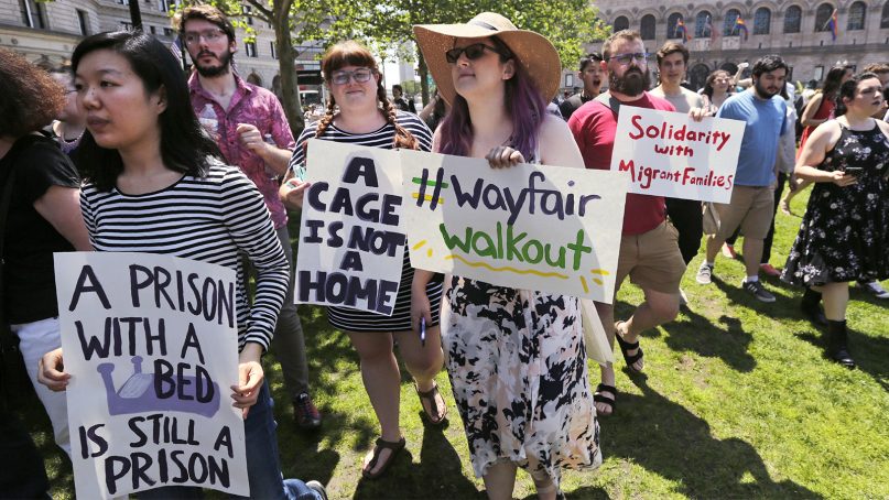 Employees of Wayfair march to Copley Square in protest prior to their rally in Boston, on June 26, 2019. Employees at online home furnishings retailer Wayfair walked out of work to protest the company's decision to sell $200,000 worth of furniture to a government contractor that runs a detention center for migrant children in Texas. (AP Photo/Charles Krupa)