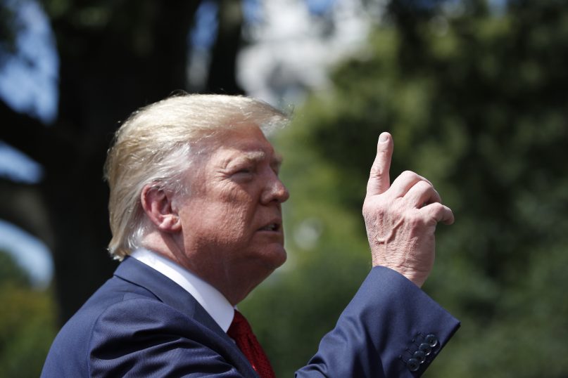 President Donald Trump speaks with reporters before departing on Marine One on the South Lawn of the White House, on Aug. 21, 2019, in Washington. (AP Photo/Alex Brandon)