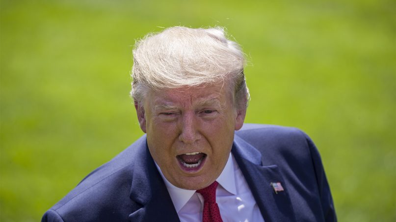 President Donald Trump speaks with reporters on the South Lawn of the White House, Aug. 21, 2019, in Washington. (AP Photo/Alex Brandon)