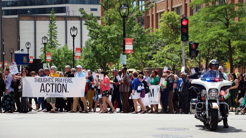 Hundreds of attendees at the ELCA Churchwide Assembly march to the ICE building in Milwaukee for a prayer vigil in support of migrant children and their families on Aug. 7, 2019. RNS photo by Emily McFarlan Miller