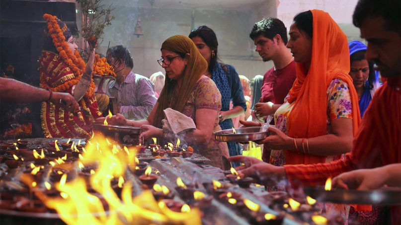 Kashmiri Hindus, known as “Pandits,” perform rituals at the Kheer Bhawani temple during an annual Hindu festival in Jammu, India, on June 2, 2017. Hundreds of Hindu devotees flocked to celebrate the festival dedicated to the goddess Durga at the temple, a replica of the original Mata Kheer Bhawani Temple near Srinagar, that was made in Jammu by Kashmiri Pandits after they were forced to flee from Srinagar and the adjoining valley areas in the early 1990s. (AP Photo/Channi Anand)