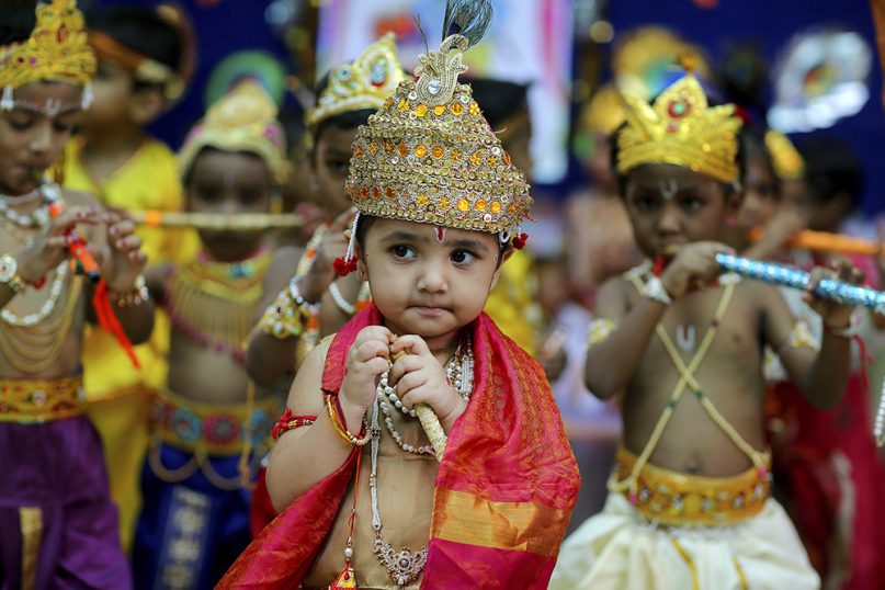Indian schoolchildren dressed as lord Krishna participate in a costume contest on the eve of the Krishna Janmashthami festival, the birth anniversary of Hindu God Krishna, in Hyderabad, India, on Aug. 23, 2019. (AP Photo/Mahesh Kumar A)