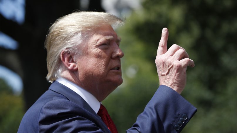 President Trump speaks with reporters before departing on Marine One on the South Lawn of the White House in Washington on Aug. 21, 2019. (AP Photo/Alex Brandon)